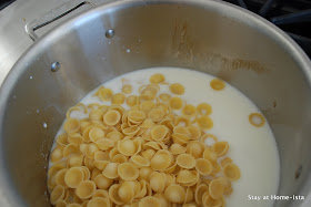 cooking pasta in the milk for easy macaroni and cheese