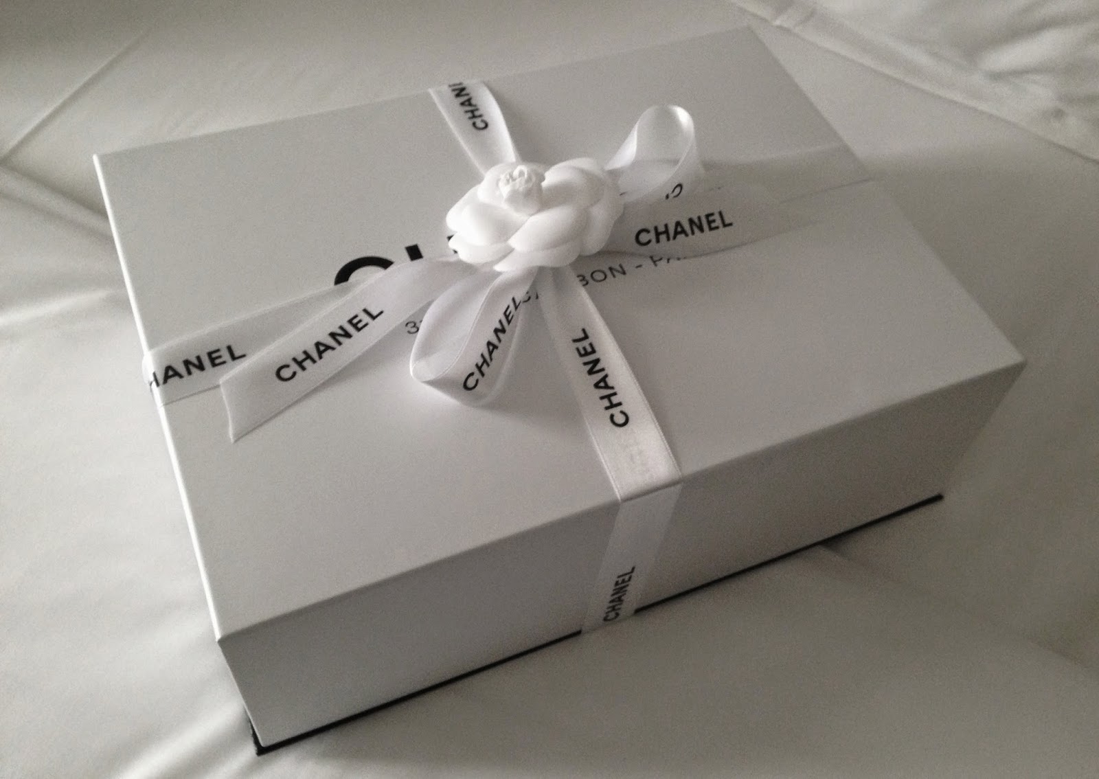 Chanel box packaging - fancy flower and ribbon.