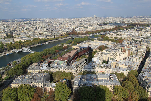 Top view of Paris downtown from the observation deck of Eiffel Tower in Paris, France Top view of Paris downtown from the observation deck of Eiffel Tower in Paris, France