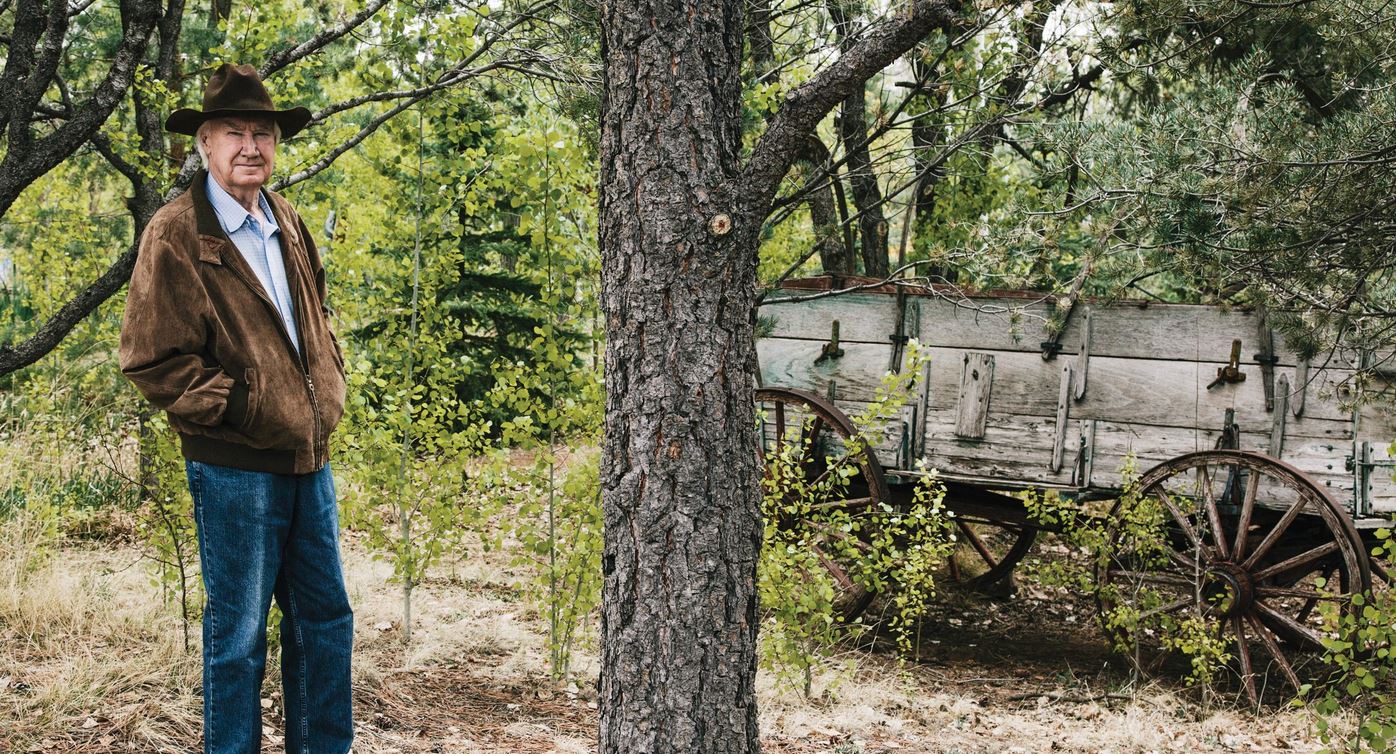 Just A Car Guy Forrest Fenn stands next to an old U.S. Army wagon in