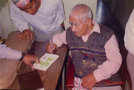 Capt. Ram Singh Thakuri marking B P Bajgain’s research book on Netaji Subhas Chandra Bose