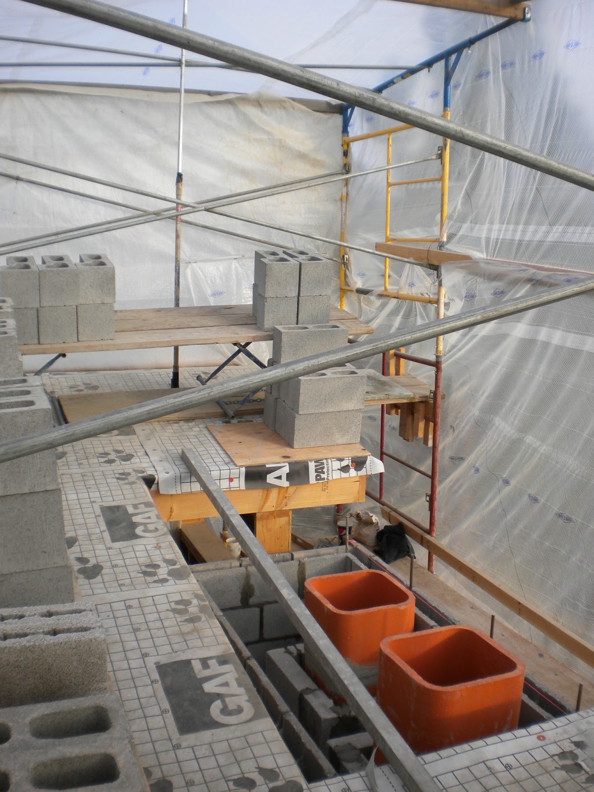 BOISINEAU MASONRY Cmu chase and flue liners are now at roof level.