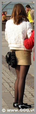 Girl in mini-skirt on the street  