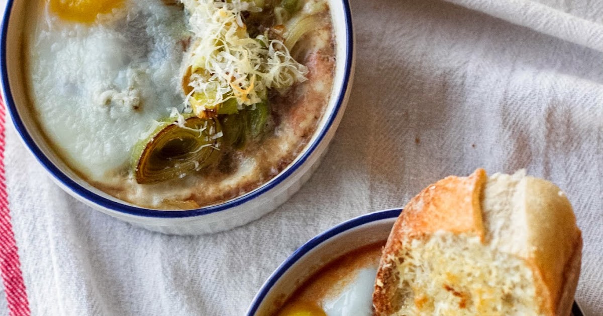 Buttered Up Baked Eggs in Stewed Tomatoes with Caramelized Leeks