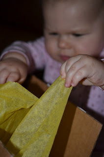 Baby opening a present