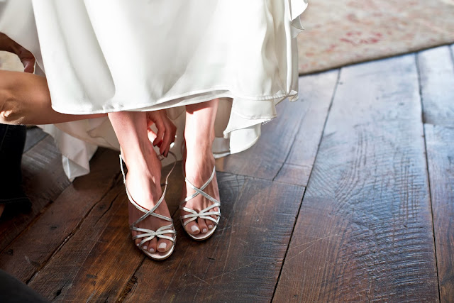 A Model Wedding, shoe touch ups in the sunlight