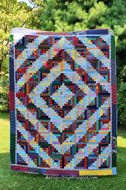 Scrappy log cabin quilt