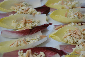 Easy appetizer for a party- just take endive, and layer on crumbled cheese, almonds and honey!
