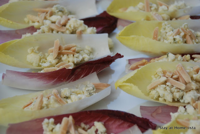 Easy appetizer for a party- just take endive, and layer on crumbled cheese, almonds and honey!