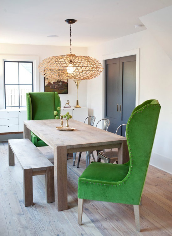 Impressive emerald wingback armchairs in the dining room
