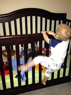 baby climbing out of crib