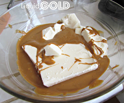 Biscoff and white chocolate melted together in a bowl.