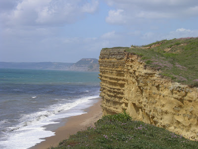 Capture the colour - Green cliffs and sea against yellow rock at Burton Bradstock