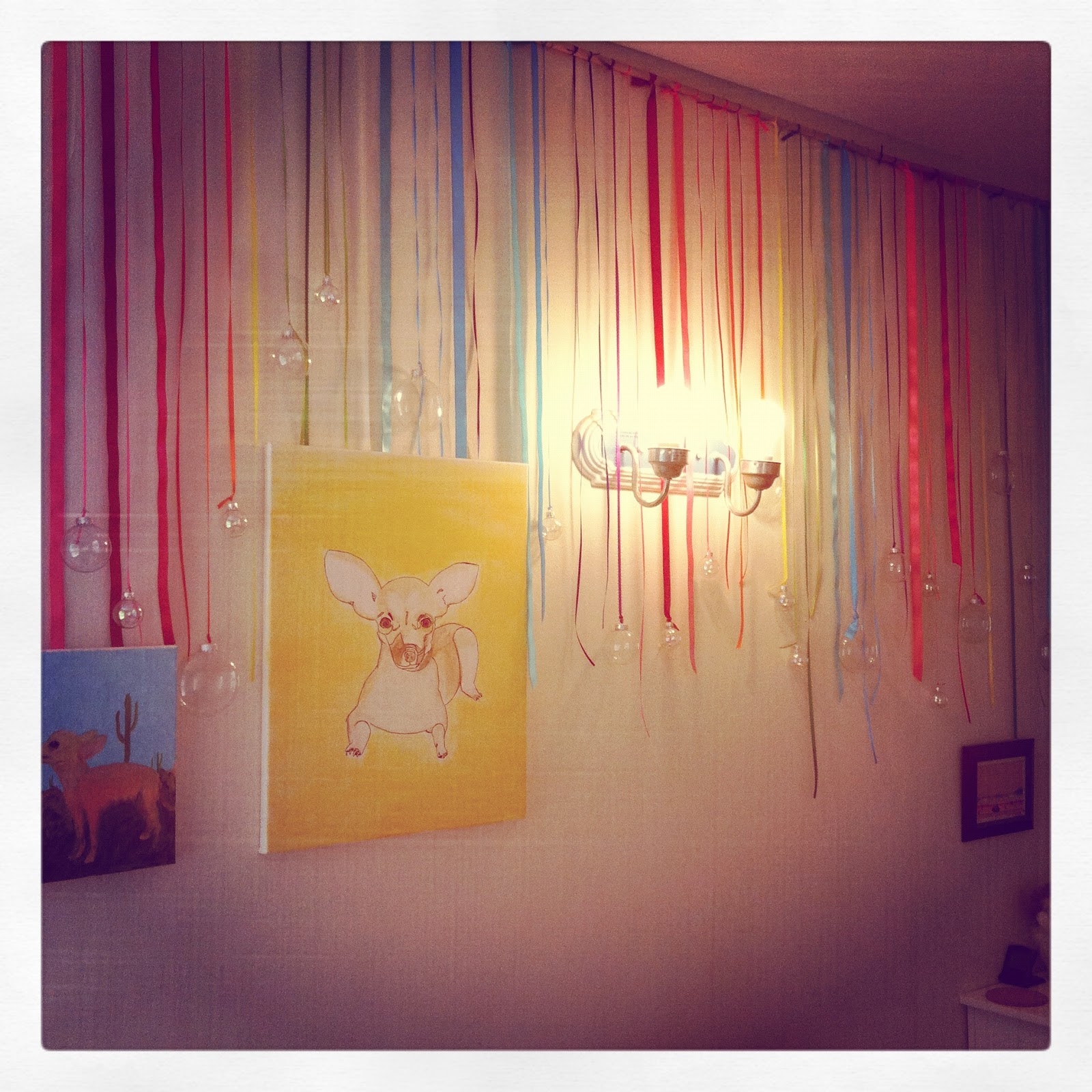 (My bestie's groovy wall hanging with clear ornaments in her room)