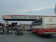 An open air bus entering the Mabalacat bus terminal. (mabalacatbusterminal)