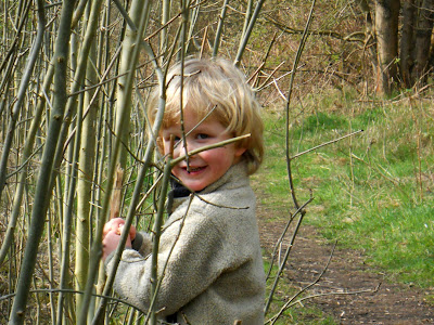 Little boy with blond hair in the country