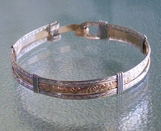 http://surfandsandjewelry.com/product/floral-14k-gold-filled-sterling-bangle/