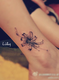 a lily flower tattoo close to the ankle