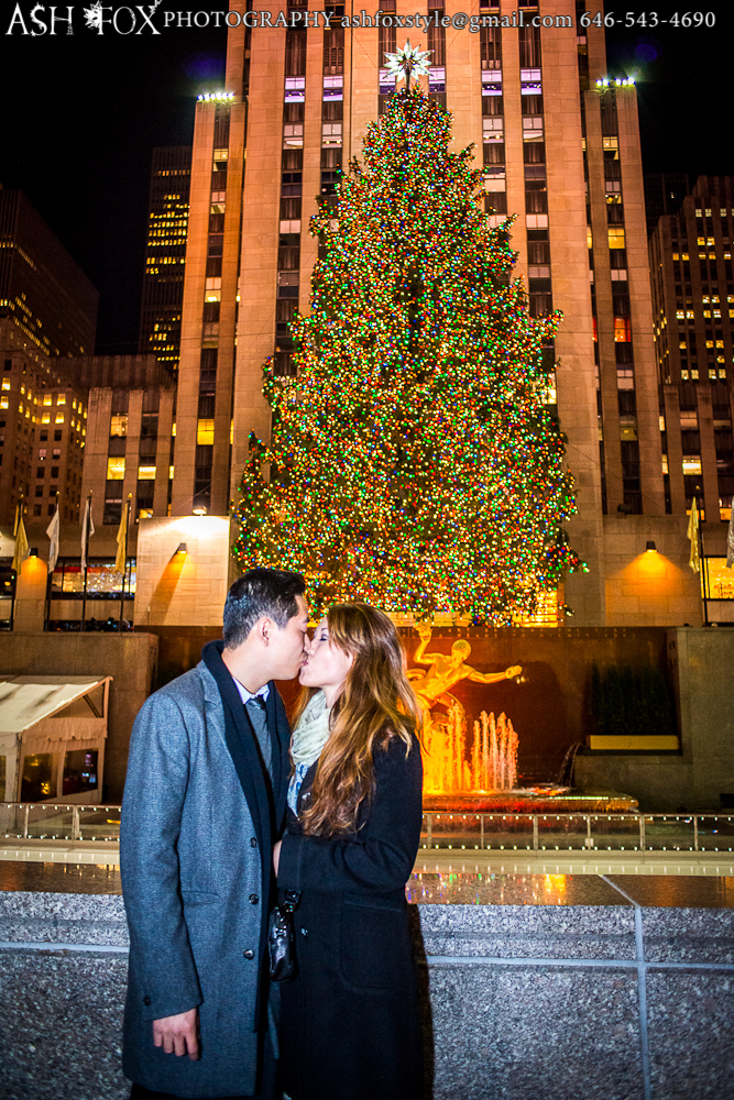 Kissing in front of the tree at Rockefeller Center after an epic proposal