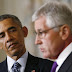 President Barack Obama listens to Defense Secretary Chuck Hagel
