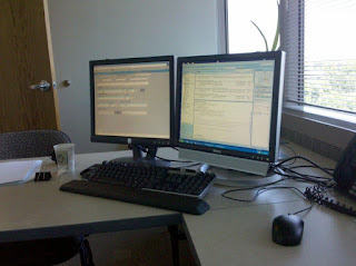 computer keyboard and dual computer screens