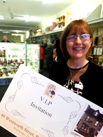 Owner of Fairy Meadow Miniatures with a VIP opening invitation.