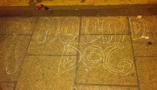 Chalk writing on the pavement