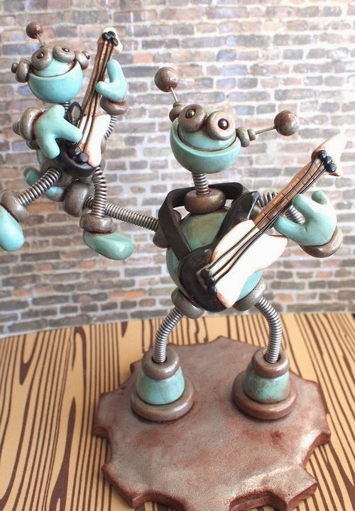 02-Father-Son-Guitar-Playing-HerArtSheLoves-Clay-Robot-World-Sculptures-www-designstack-co