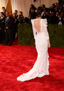 Rooney Mara wearing open back white gown