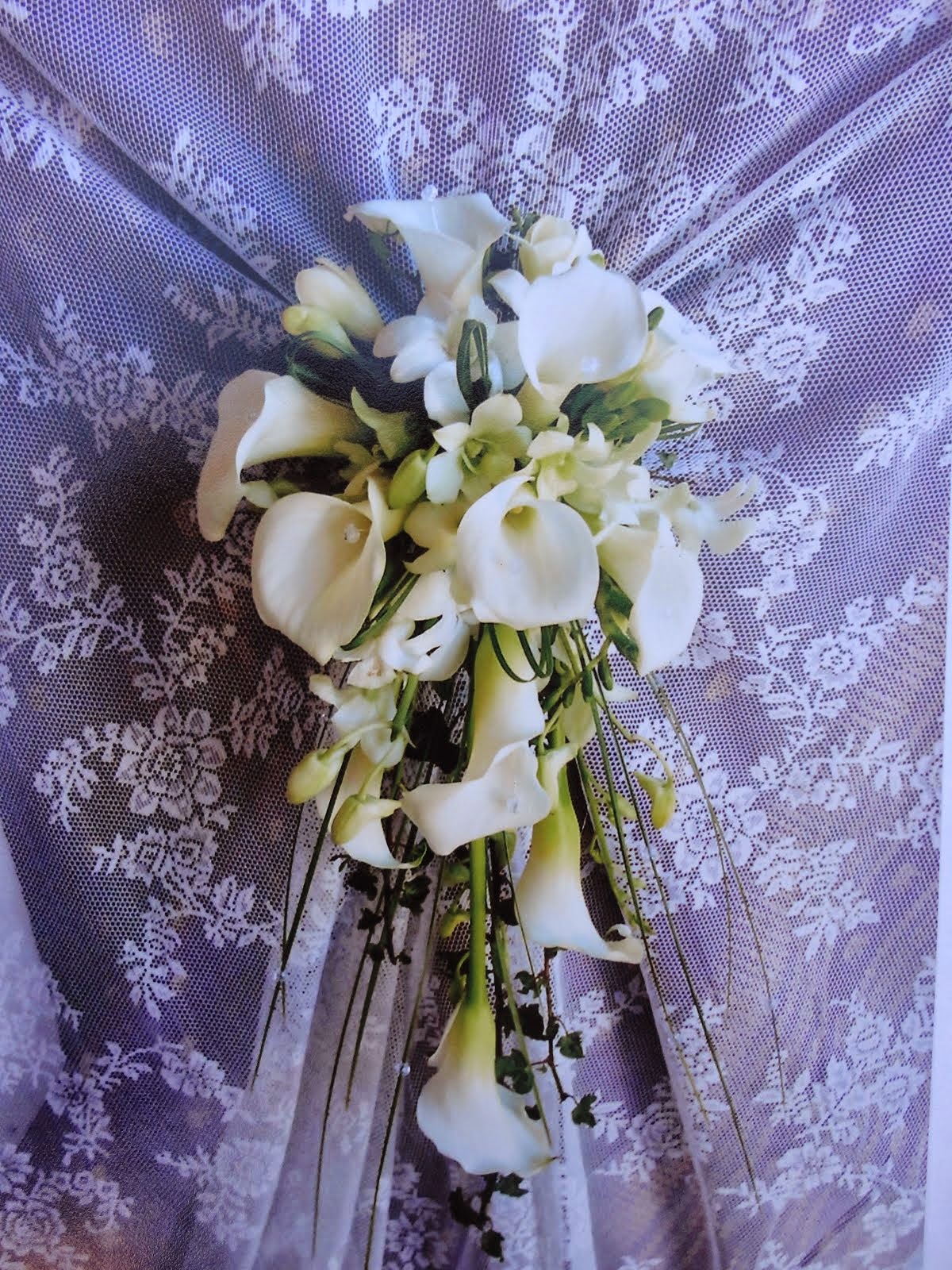 Calla lily and dendrobium orchid bouquet