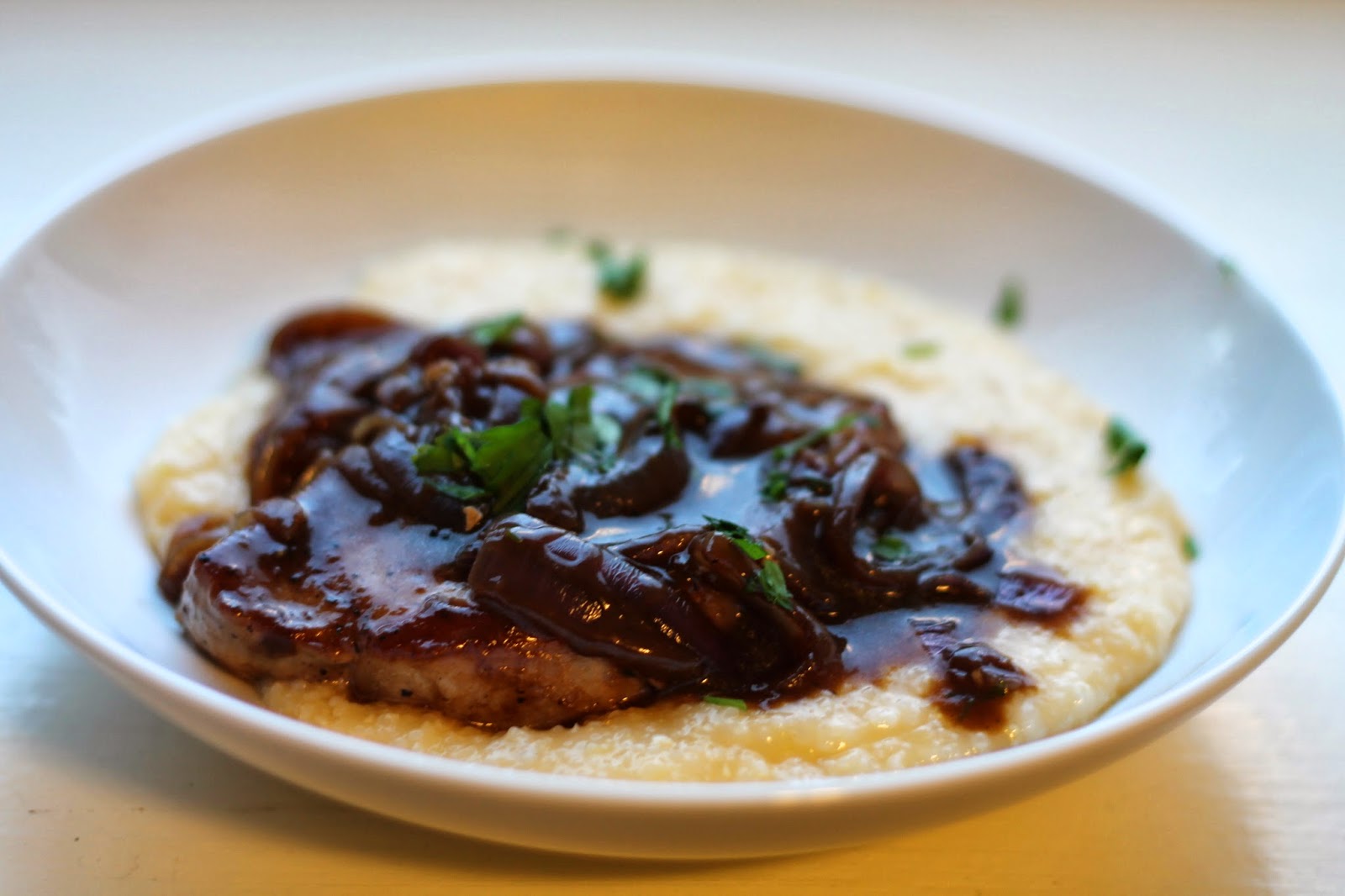 Young and Entertaining Smothered Pork Chops with Cheese Grits