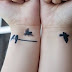 Flying black small birds tattoo on wrists