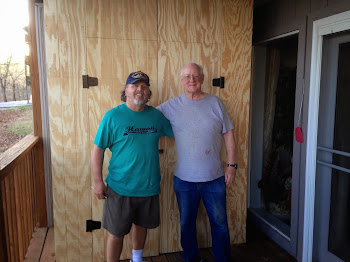 Tim and Jim in front of the storage closet they built.