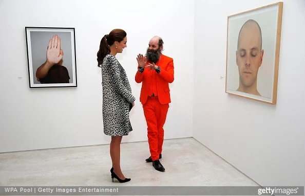  Catherine, Duchess of Cambridge talks to artist Gavin Turk about his painting 'Portrait of Something that I'll Never Really See' (R) during a visit to Turner Contemporary on March 11, 2015 in Margate, England