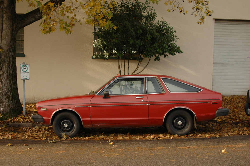 OLD PARKED CARS. 1979 Datsun 210 Hatchback.