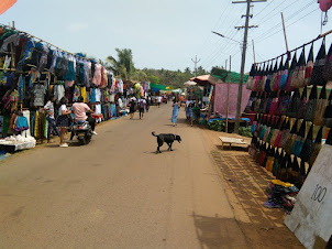 Walking along the  " Wednesday Flea market " road in Anjuna that ends at the beach