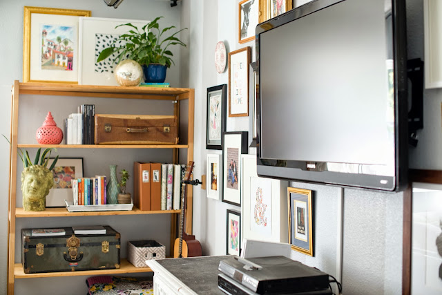 Decorating around the tv and styling and open shelf.