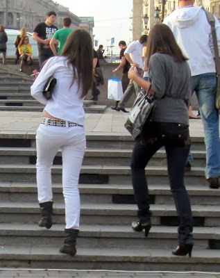 Girl in white tight jeans on the street