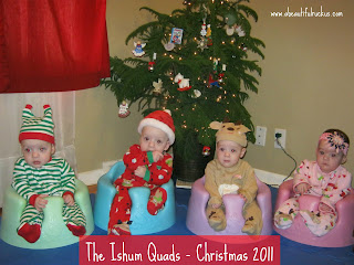 cute kids dressed up in Christmas outfits around Christmas tree