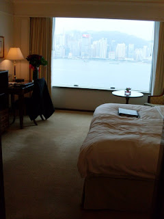 a room with a large window overlooking a city