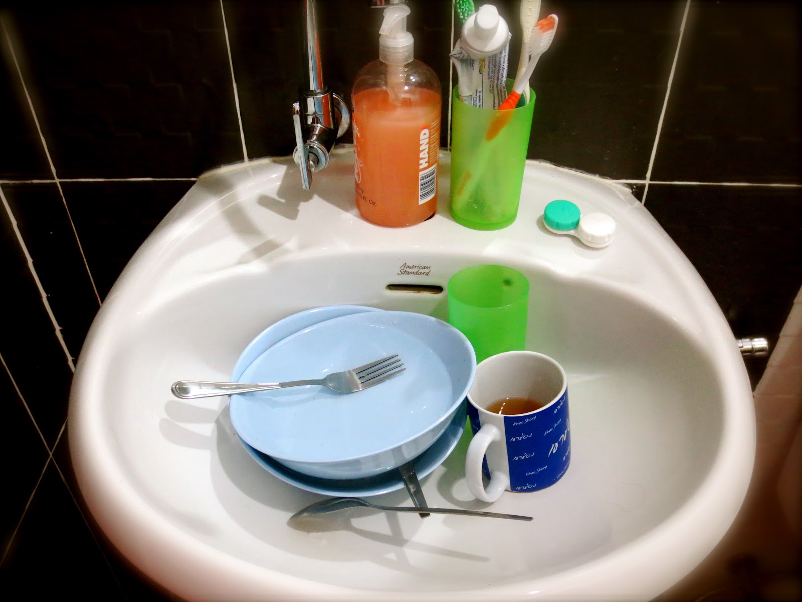 Scott & Jody's Adventures Abroad Washing Dishes in the Bathroom Sink