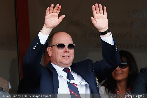 Albert II, Prince of Monaco and Melanie-Antoinette de Massy taking part in the mexican wave during day seven of the Monte Carlo Rolex Masters tennis at the Monte-Carlo Sporting Club