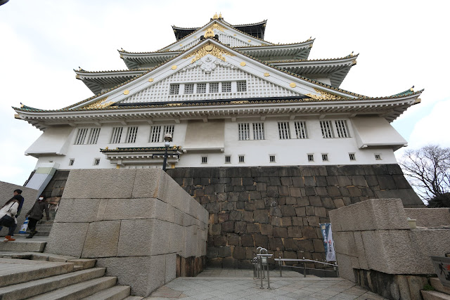 Half way to Osaka Castle which is covered with some gold elements in Osaka, Japan Half way to Osaka Castle which is covered with some gold elements in Osaka, Japan