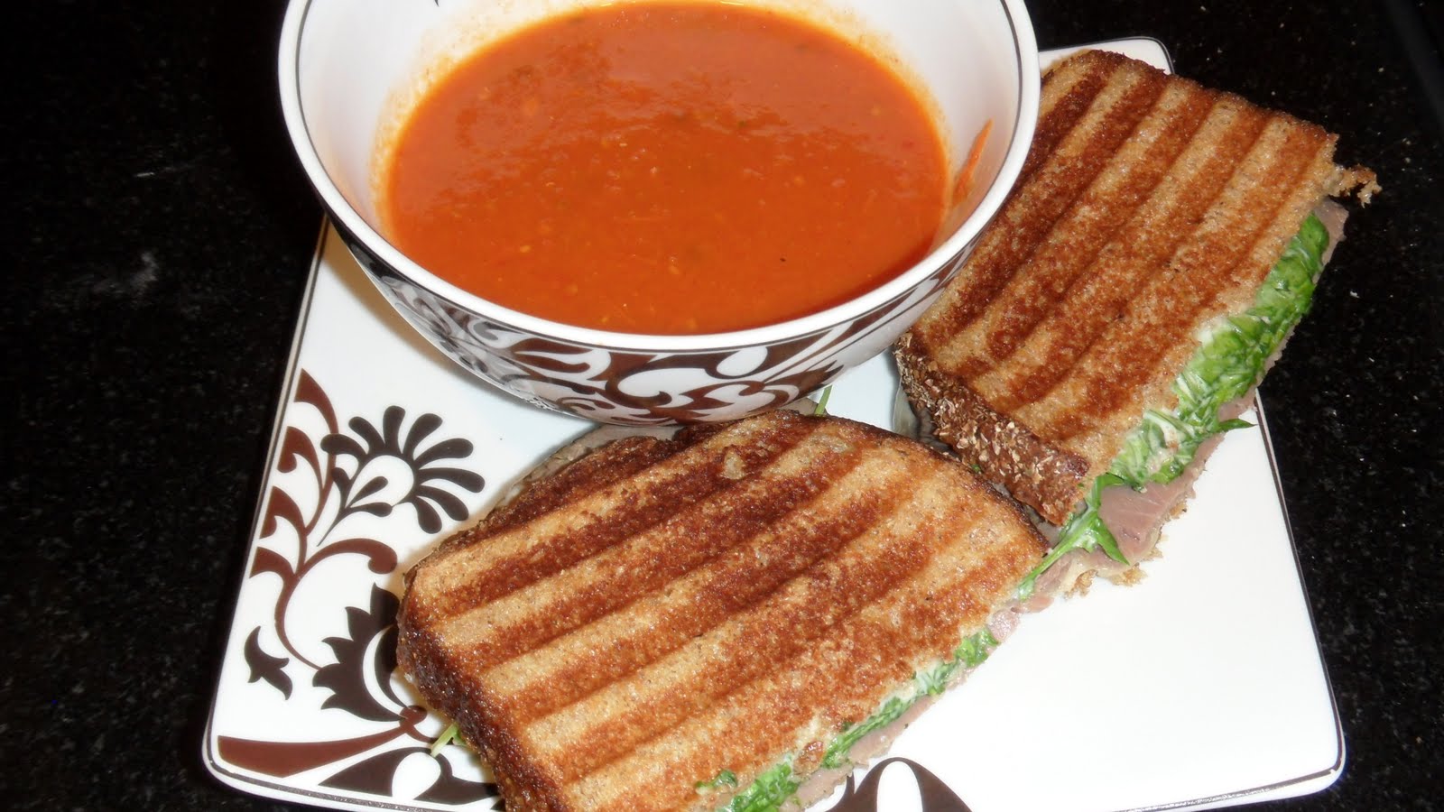 Roasted Tomato Soup with Roast Beef, Cheddar, and Horseradish Panini