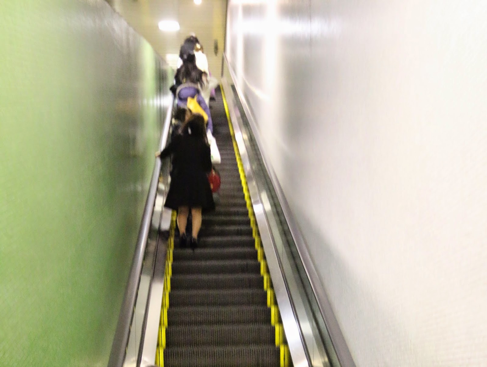 Japanese Escalator Etiquette is by standing on the left side in Tokyo while standing on the right side in Osaka in order to allow others passing by Japanese Escalator Etiquette is by standing on the left side in Tokyo while standing on the right side in Osaka in order to allow others passing by