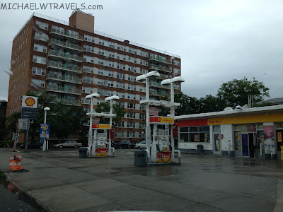 a gas station in front of a building