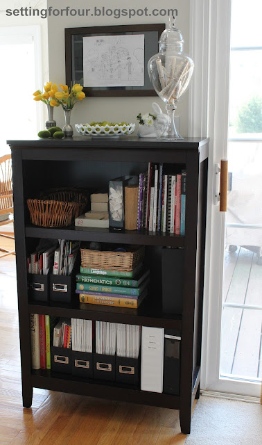 See how I organized my family and simplified our lives with the Bookcase Family Organizer! See how I organized my cookbooks and the kid's study and homework supplies all in one place with easy storage ideas!