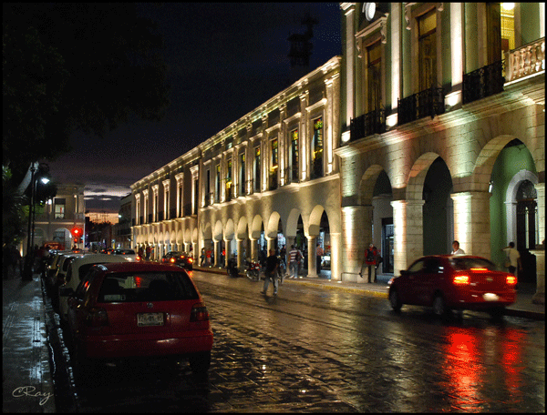 Merida Mexico's Governor's Palace at night with street traffic