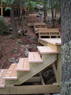 Cedar steps from the lake up to the cabin,  https://www.huismanconcepts.com/