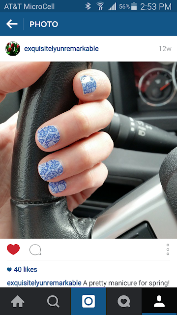 Blue Floral Nail Wraps on Hand on Steering Wheel
